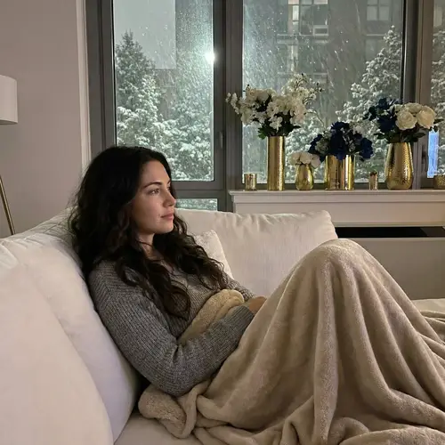 Serenity in Snow: A Caribbean Woman's Peaceful Moment