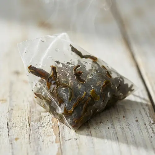 Premium Oolong Tea Sachet on Wooden Table