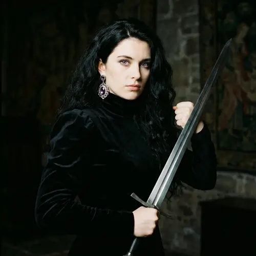 Young English Girl with Black Wavy Hair Holding Sword