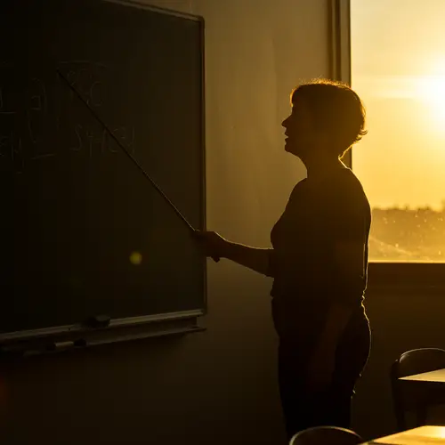 Teacher Silhouette Indicating Blackboard