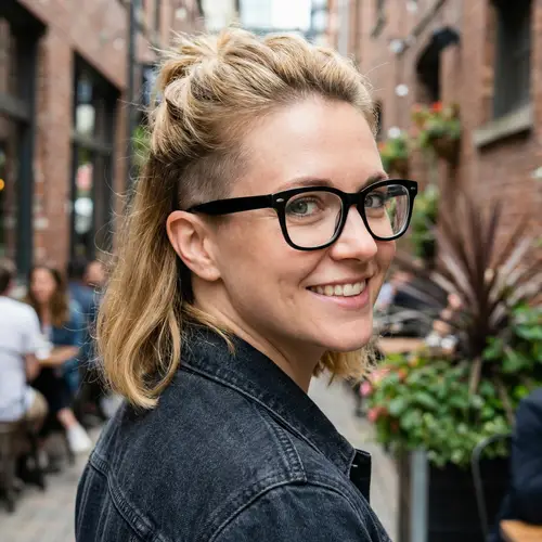 Blond Woman with Green Eyes and Black Glasses