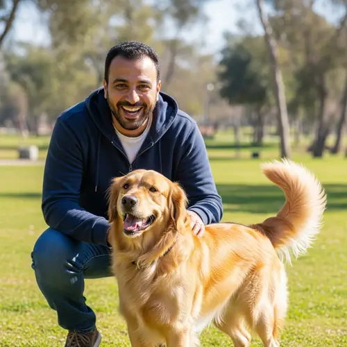 Cheerful Middle-Eastern Man with Golden Retriever in Sunny Park