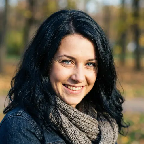 Portrait of a Young Woman with Sapphire Blue Eyes and Raven-Black Hair