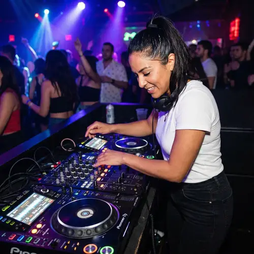 Latinx Female DJ at Professional Music Console | Nightclub Scene
