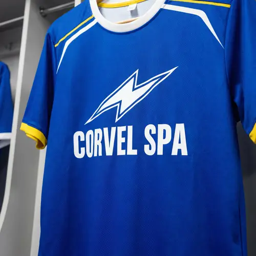CORVEL SPA Blue Soccer Jersey with Lightning Logo