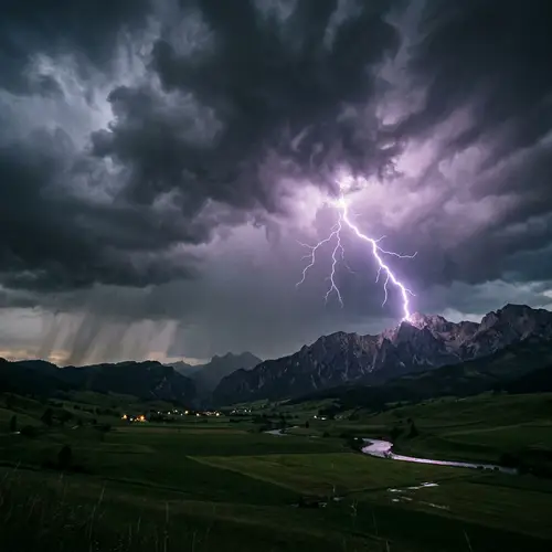 Dramatic Lightning Strike over Green Fields and Mountains