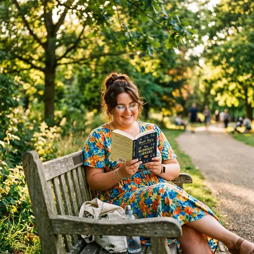 Stylish Plus-Size Woman Enjoying a Book in the Park