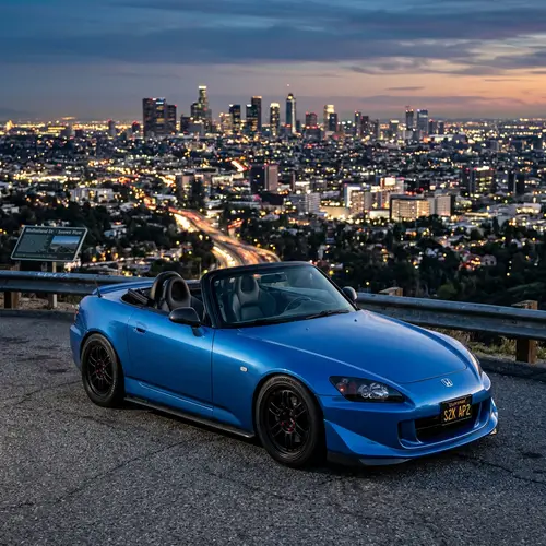 Blue Honda S2000 with Enkai RPF1 Wheels - City View