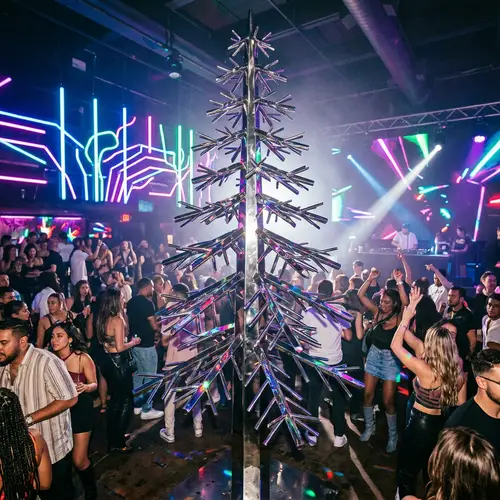 Steel Pine Tree Sculpture in Vibrant Club Setting