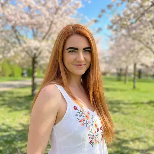 Copper-Colored Hair Woman with Captivating Smile