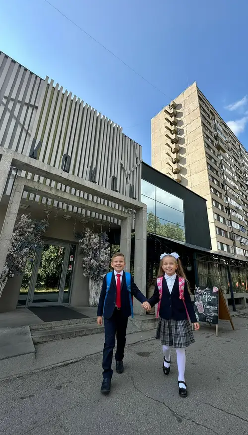 Cheerful First-Graders Headed to School