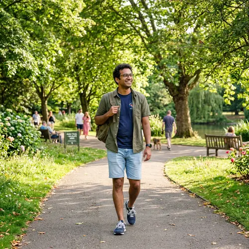 Stylish South Asian Man Enjoying Park Stroll | Company Name