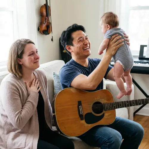 Eastern Asian Male Musician Playing with Baby | Heartwarming Scene