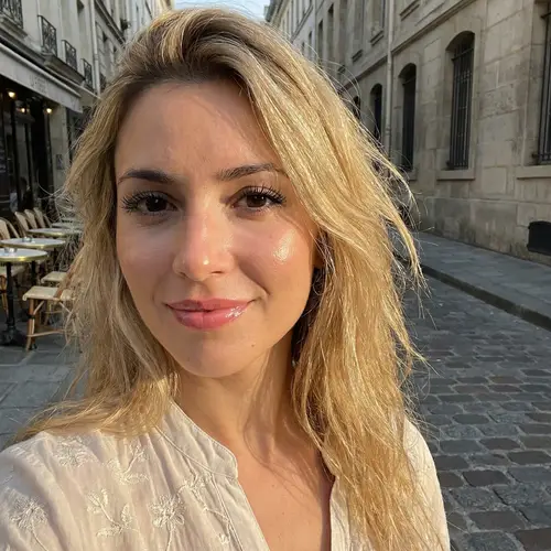 Captivating French Woman with Long Blonde Hair and Enchanting Black Eyes