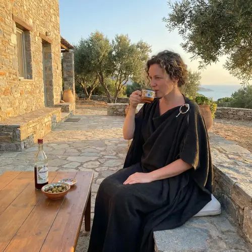 Ancient Greek Attire: Caucasian Woman Sipping Vermouth