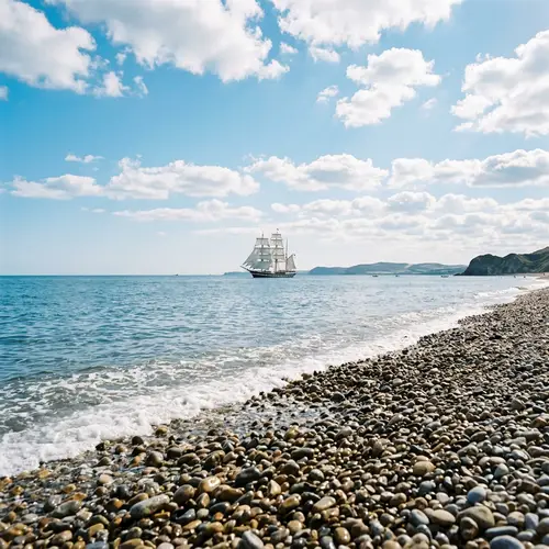 Tranquil Seascape with Grand Sailing Ship | Glistening Pebble Beach