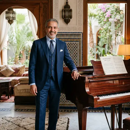 Moroccan Man in Blue Suit by Piano