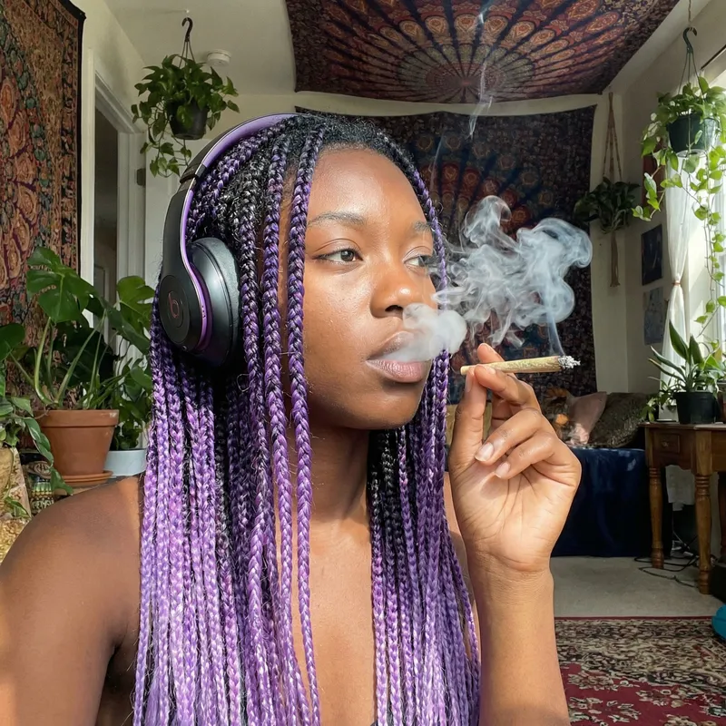 Dark Skin Woman with Purple Ombre Hair Smoking Weed