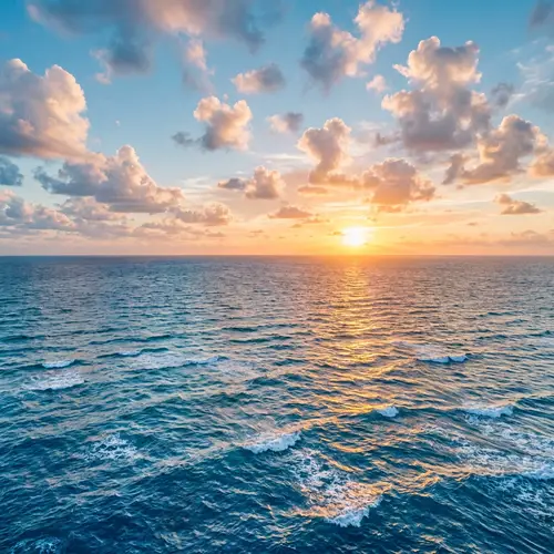 Tranquil Sea at Sunset: Shades of Blue and Whitecaps
