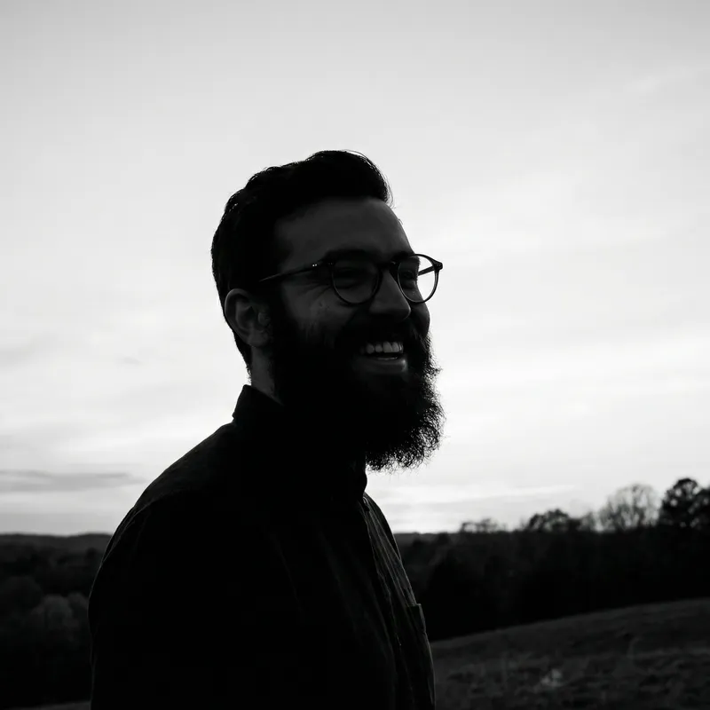 Smiling Bearded Man Silhouette in Stylish Glasses