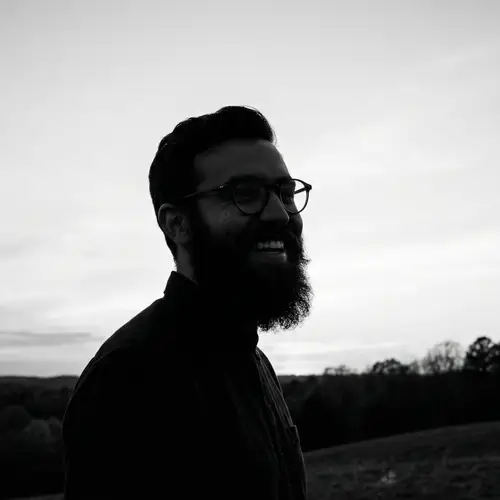 Happy Bearded Man Silhouette with Stylish Glasses