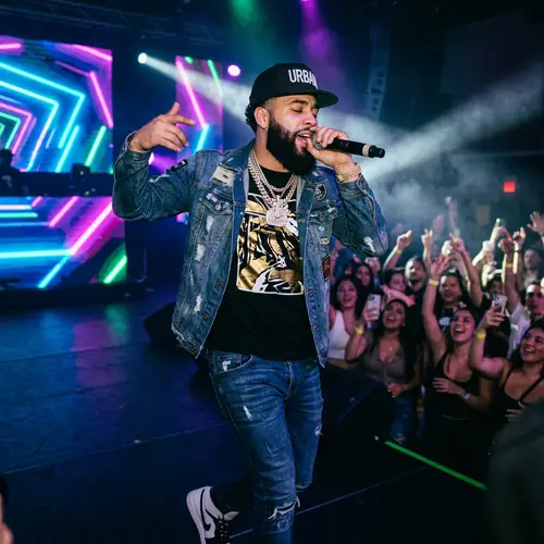Passionate Male Reggaeton Artist on Stage | Trendy Urban Fashion