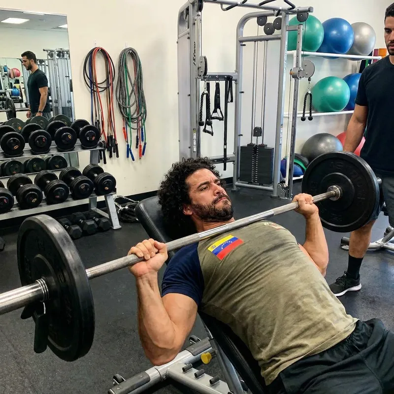 Venezuelan Man Bench Press with Barbell on Neck