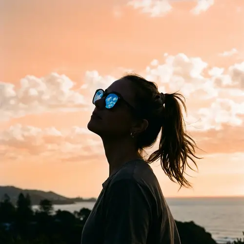 Woman in Sunglasses Silhouette on Pastel Background