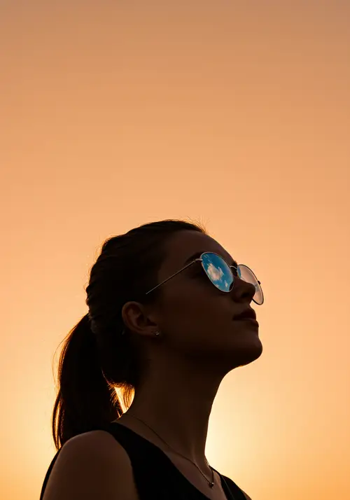 Woman in Sunglasses Silhouette on Pastel Background