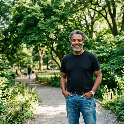 Middle-Aged Black Man in Casual Attire & Serene Park Setting