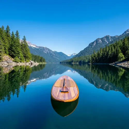 Tranquil Stand-Up Paddleboarding on Serene Lake