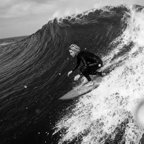 Thrilling Black and White Surfer Moment | Extreme Water Sports