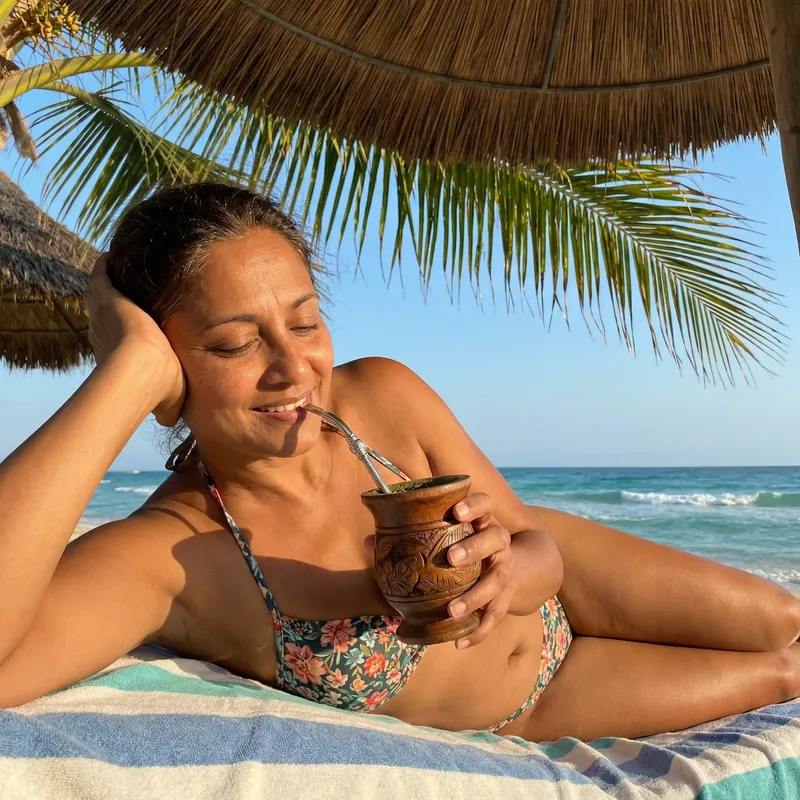 Beach Day Relaxation: Woman in Bikini Drinking Yerba Mate Tea