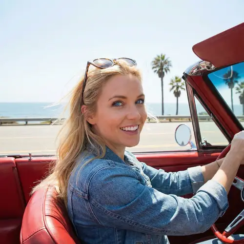 Blonde Woman Driving Convertible Car