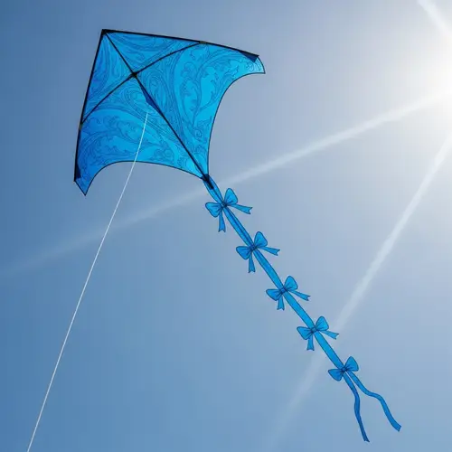 Vibrant Blue Traditional Kite Soaring High in Clear Blue Sky