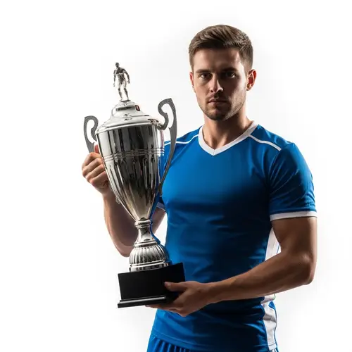 Professional Footballer with Trophy in Studio Setting