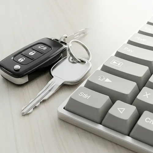 Car Keys and Programming Keys on Wooden Table
