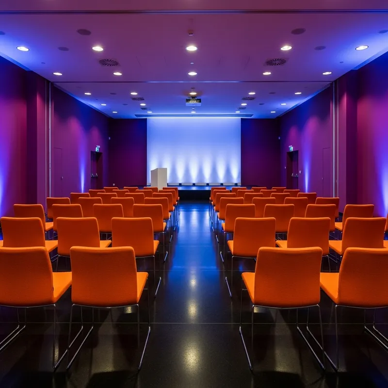 Elegant Conference Hall with Purple Walls & Orange Chairs Elegant Conference Hall with Purple Walls & Orange Chairs