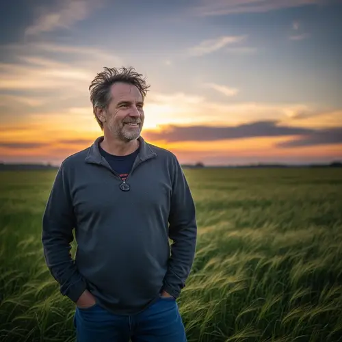 Casual Man Enjoying a Sunset in a Field