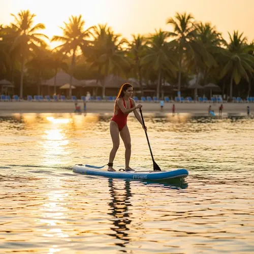 Athletic Middle-Eastern Woman Stand Up Paddle Boarding at Sunset