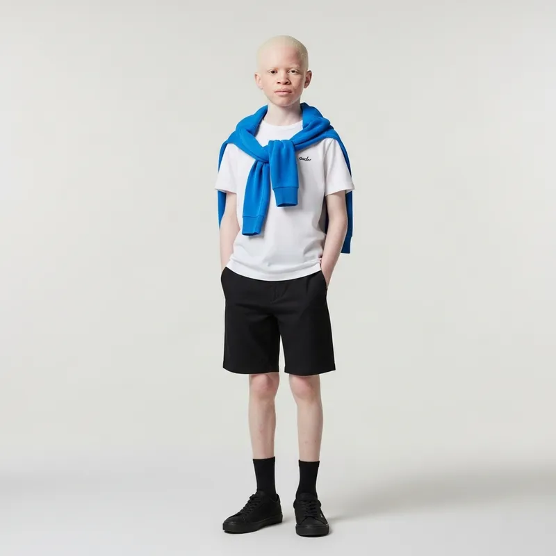 Albino Boy in Black Shorts and Blue Sweater Albino Boy in Black Shorts and Blue Sweater