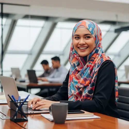 Cheerful Malay Woman in Professional Office Setting