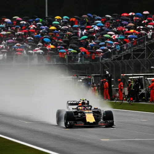 F1 Car Racing in the Rain: Speed and Spectacle