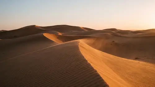 Stunning Desert Dunes at Golden Hour: A Cinematic View