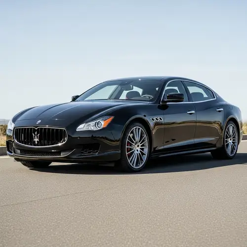 Black 2014 Maserati Quattroporte S Q4 on Smooth Asphalt Road