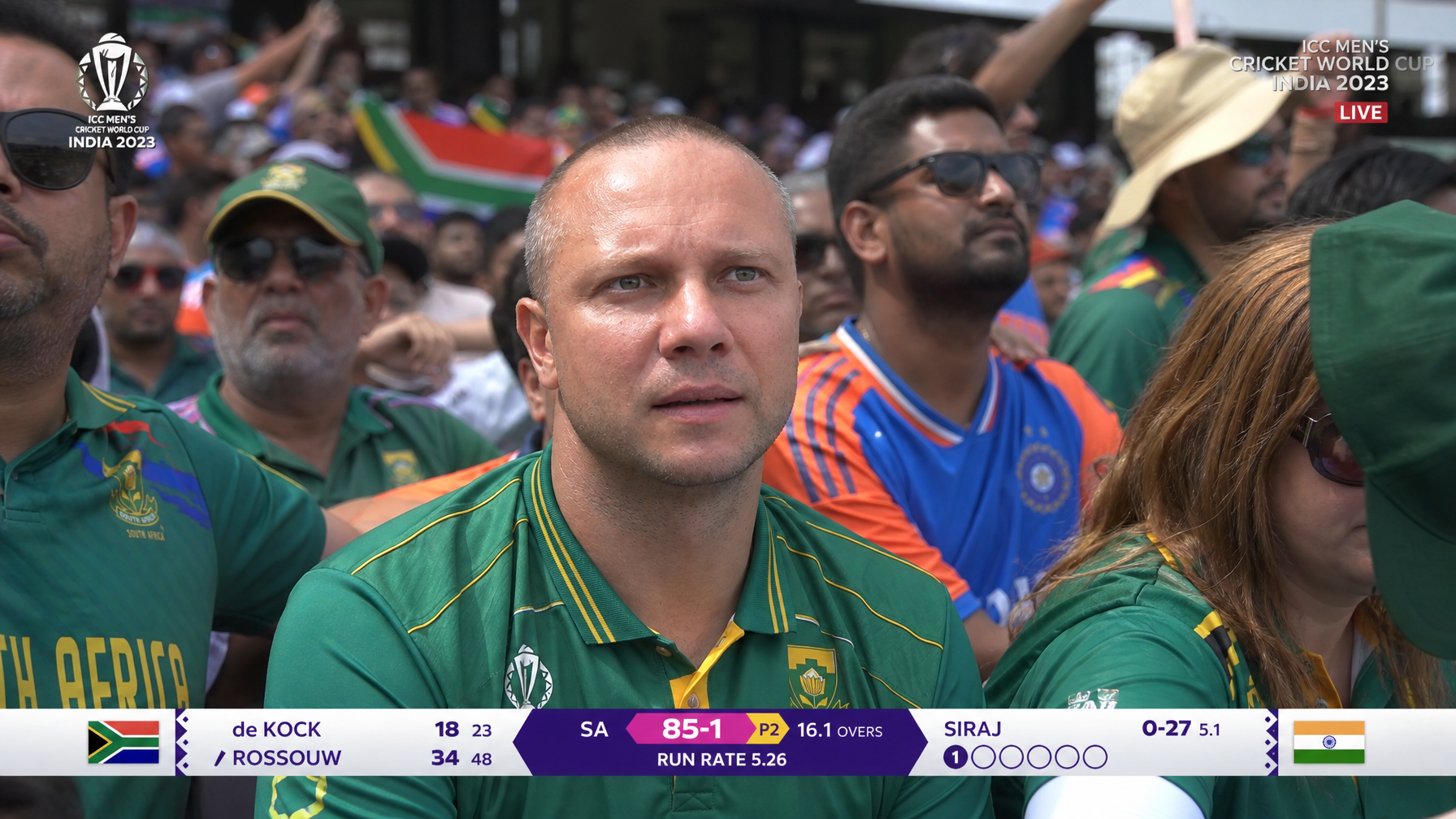 AI cricket stadium fan cam image with overs and run-rate broadcast graphics