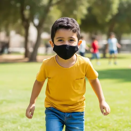 Young Middle-Eastern Boy in Black Mask Outdoors
