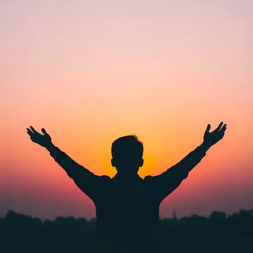 Serene Silhouette Against a Vibrant Sunrise