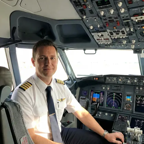 Airline Pilot in Cockpit - Uniform Photo