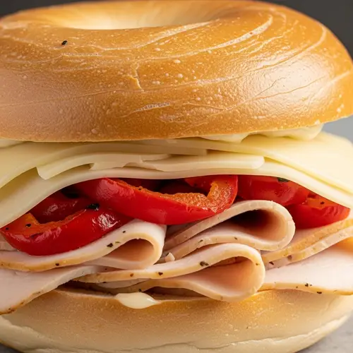 Delicious Bagel Sandwich with Turkey, Roasted Red Pepper, and Swiss Cheese